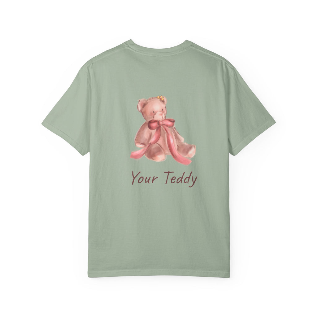 the back of the Light green t-shirt with a teddy bear design and 'Your Teddy' text on a white background