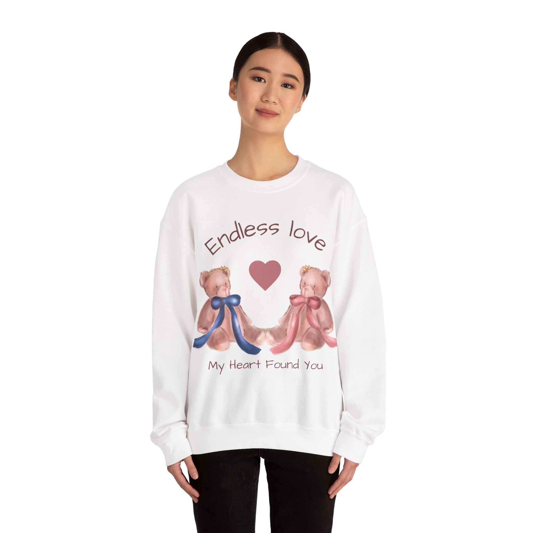 Person wearing a white sweatshirt with teddy bears and text on a white background