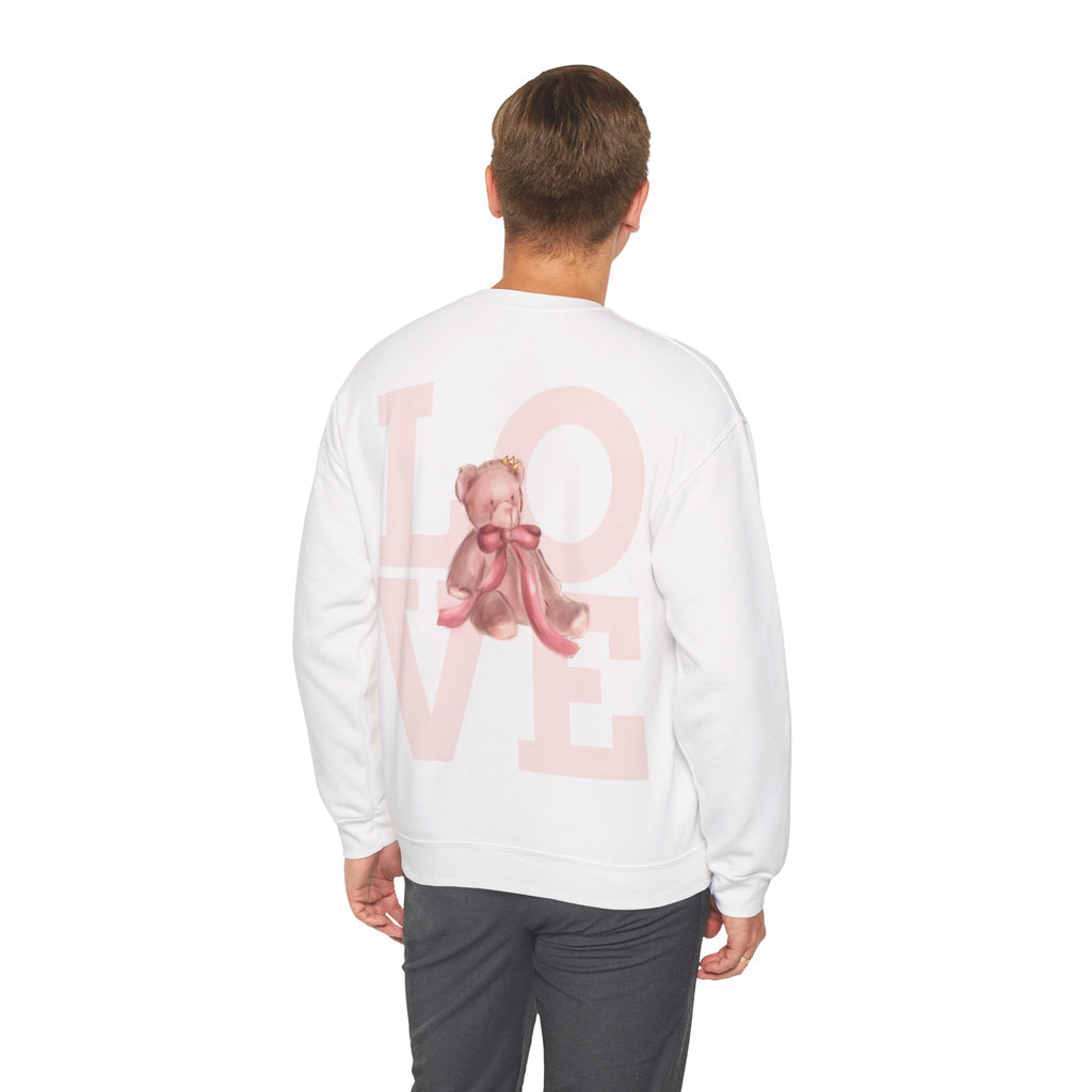 Person wearing a white sweatshirt with a pink teddy bear and 'LOVE' text on the back.