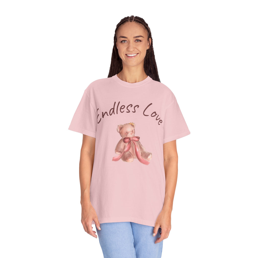 Person wearing a pink t-shirt with a teddy bear graphic and 'Endless Love' text on a white background