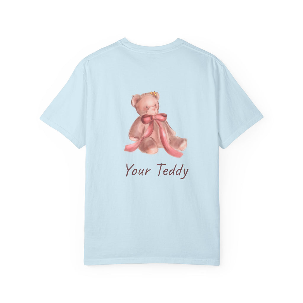 the back of Light blue t-shirt with a teddy bear design and 'Your Teddy' text on a white background