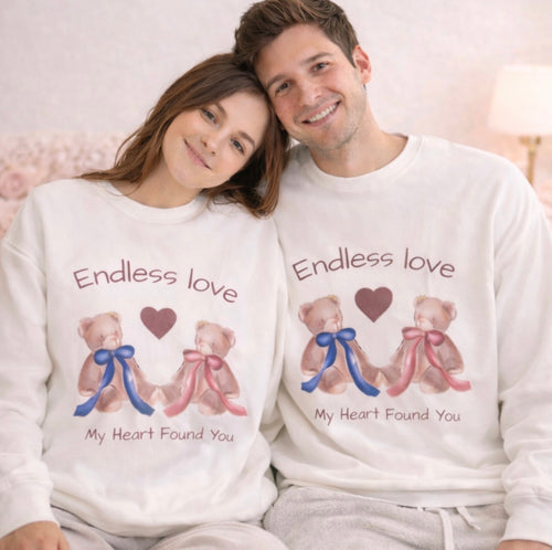 the soft sweatshirt with teddy bear design worn by a couple
